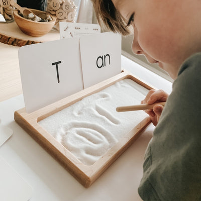 Montessori homeschool wooden tracing tray with note card stand.
