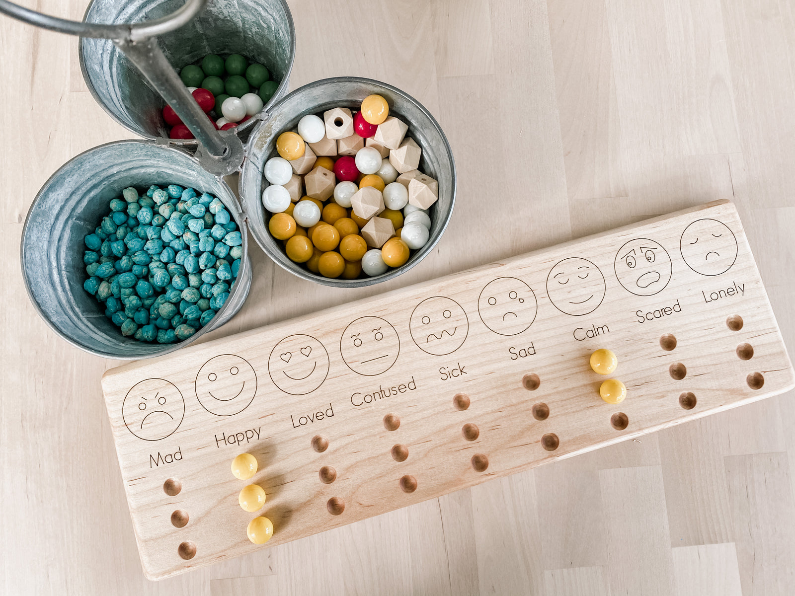 Wooden emotions board for toddlers and kids to mark down and express their emotions.