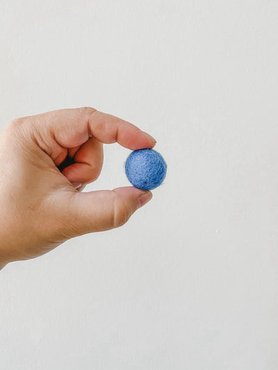 Large chunky blue felt ball.